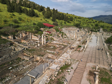 Roman columns and hillside ruins along the marble avenue in Ephesus, Turkey
