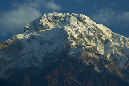 Snowy precipices of southern Annapurna. Trekking to Annapurna Base Camp, Nepal.の写真素材