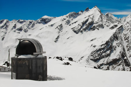 Telescope in the snowy mountains. Telescope in the snowy mountains of the Elbrus region, Russia, the...