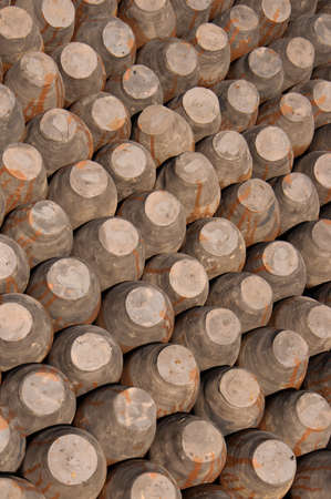 rows of pots, bottoms up, background. Traditional Ceramic Pottery in Potter Square, Bhaktapur Town, Nepalの写真素材