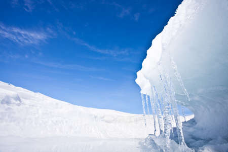 Ice wave on Lake Baikal, winter landscape with icicles and blue skyの写真素材