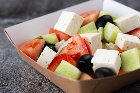 
Greek salad of fresh vegetables with tomato, cucumber, olives and cheese. salad dressed with olive oilの写真素材