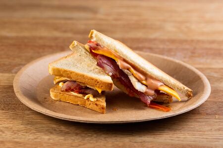 toast bread sandwich with bacon, cheese and cream sauceの写真素材