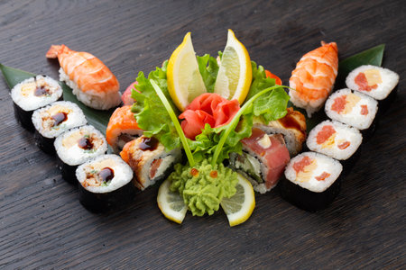 japanese sushi food. Maki ands rolls with tuna, salmon, shrimp, crab and avocado. Top view of assorted sushi. Rainbow sushi roll, uramaki, hosomaki and nigiri.の写真素材