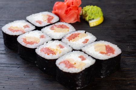 japanese sushi food. Maki ands rolls with tuna, salmon, shrimp, crab and avocado. Top view of assorted sushi. Rainbow sushi roll, uramaki, hosomaki and nigiri.の写真素材
