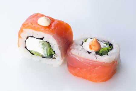 traditional Japanese cuisine. japanese sushi isolated on white background. maki sushi with salmon, cucumber, soft cheese (Philadelphia)の写真素材