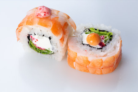 traditional Japanese cuisine. japanese sushi isolated on white background. maki sushi with shrimp, cucumber, soft cheese (Philadelphia) and red caviarの写真素材
