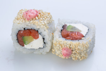 traditional Japanese cuisine. japanese sushi isolated on white background. maki sushi with tuna, avocado, soft cheese (Philadelphia) and white sesameの写真素材