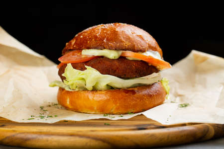 Perfect hamburger classic burger american cheeseburger with cheese, bacon, tomato and lettuceの写真素材
