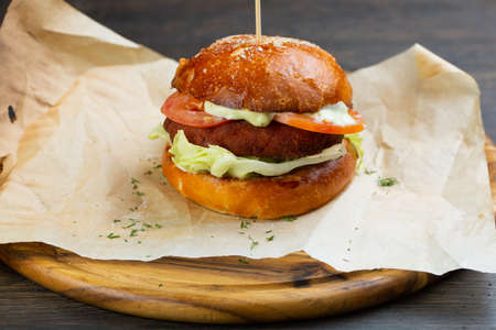 Perfect hamburger classic burger american cheeseburger with cheese, bacon, tomato and lettuceの写真素材
