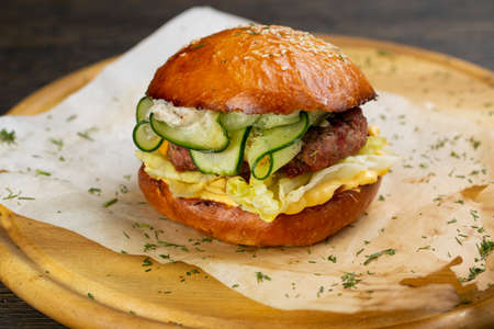 Perfect hamburger classic burger american cheeseburger with cheese, bacon, tomato and lettuceの写真素材