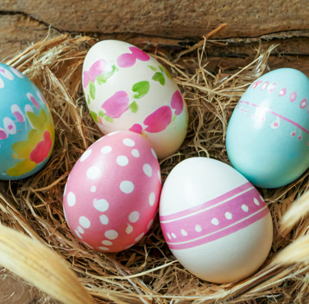 Colorful easter eggs in a nest on rustic wooden background created with the help of artificial intelligence technologiesの素材