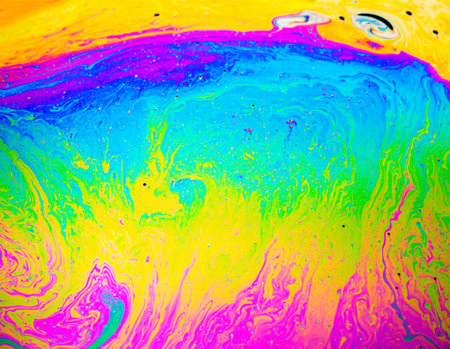 Coloful rainbow psychedelic abstract patternt on soap bubble surface. Macro shot for designの写真素材