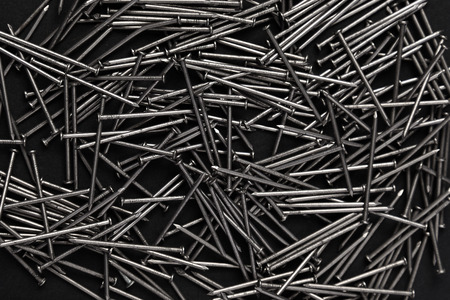 hobnails scattered on a dark backgroundの写真素材