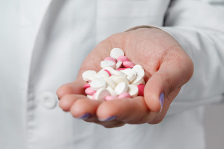 Colorful pills and medicines in the hand.