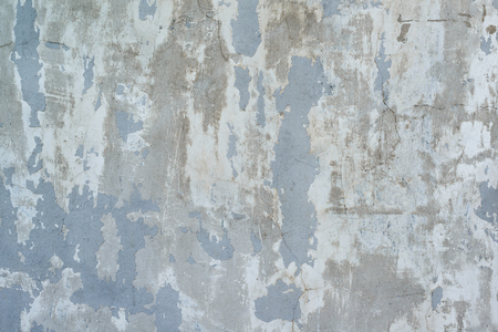 grunge texture of peeling plaster and concrete with cracksの写真素材