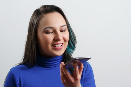 Women Using the voice recognition function, smart phones , Technology.の写真素材