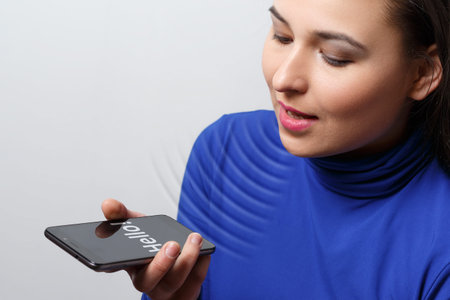 Women Using the voice recognition function, smart phones , Technology.の写真素材