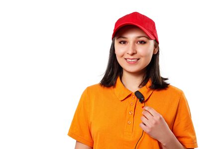 portrait of a young woman in bright clothes with a pins microphone. isolated on white backgroundの写真素材