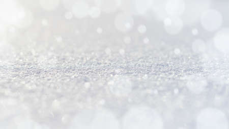 Macro texture of the snow with bokeh highlights, and a place for the inscriptionの写真素材