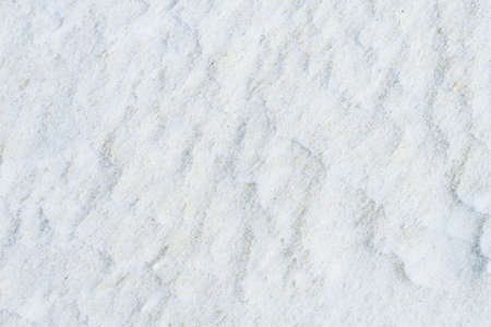 White wavy fine-grained texture with dark inclusions. High resolution.の写真素材