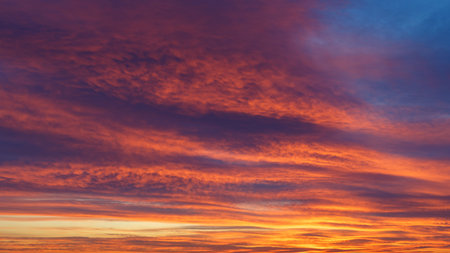 Sunset sun with colorful sky and bright clouds.