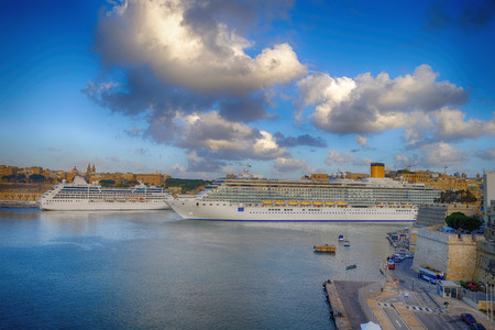 Two cruise ships at the grand harbor of Valetta, Maltaの写真素材