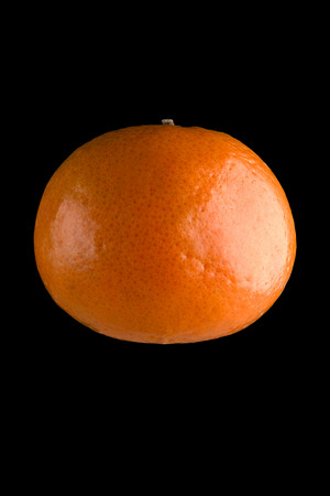 mandarine isolated on the blackの写真素材