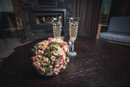 Bride bouquet with glass of champagneの写真素材