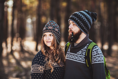 Outdoor happy couple. The bearded guy with tobacco pipeの写真素材