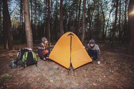 Couple tent camping in the wildernessの写真素材