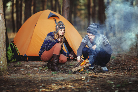 Couple tent camping in the wildernessの写真素材
