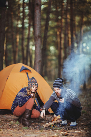 Couple tent camping in the wildernessの写真素材