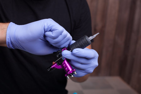 Tattooist makes a tattoo. Closeup