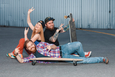 Youth people spends free time at a skatepark