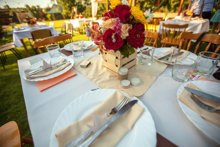 decorated table with flowers in the garden