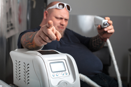 The professional machine for removal of tattoos with masterの写真素材