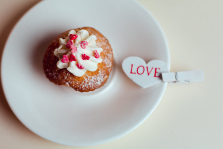 Beautiful cakes cupcakes on a white wooden table from the heart