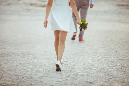 Couple walking on beach. Weddingの写真素材