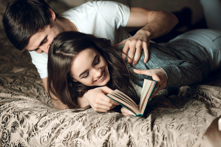 Young beautiful pair of lovers hug and kissの写真素材