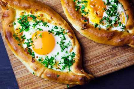 Beautiful open pies with egg and onions on wooden backgroundの写真素材