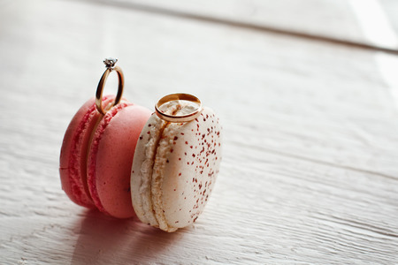 beautiful wedding rings on macaroons variety. wedding partyの写真素材