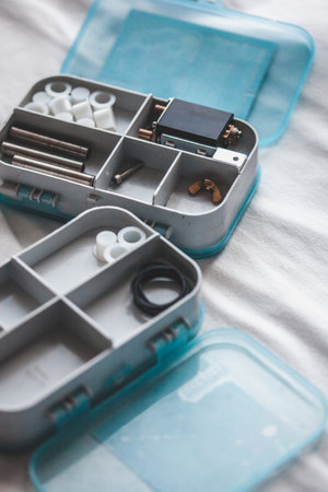 Tattoo artist preparing for work, details to tattoo machine and capsules for paintsの写真素材