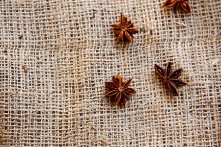 Food Background with fragrant spices Close-up of Star Anise on burlapの写真素材
