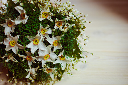 Beautiful and original bouquet of flowers lying on the windowsillの写真素材