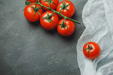 Fresh grape tomatoes cherry for use as cooking ingredients with copyspaceの写真素材