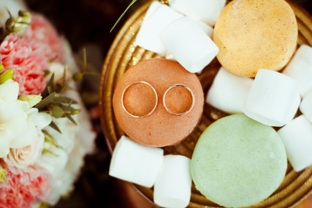 Beautiful engagement ring with marshmallows and biscuitsの写真素材