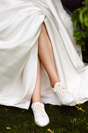 A close up image of elegant floor-length wedding dress. Concept of bride morning.の写真素材