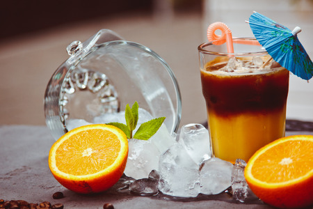 Fresh ice coffee with orange, with mint and ice. Alcoholic, non-alcoholic drink-beverageの写真素材