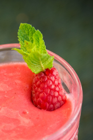 Beautiful Raspberry smoothie with berries and fresh mintの写真素材
